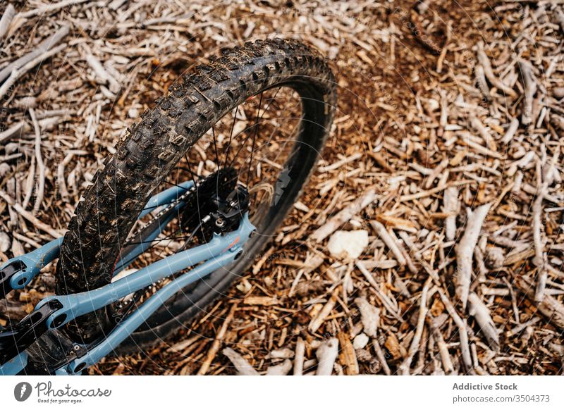 Bike on ground in countryside bicycle trip rough transport ride modern terrain route gear brown soil vehicle bike adventure equipment contemporary travel