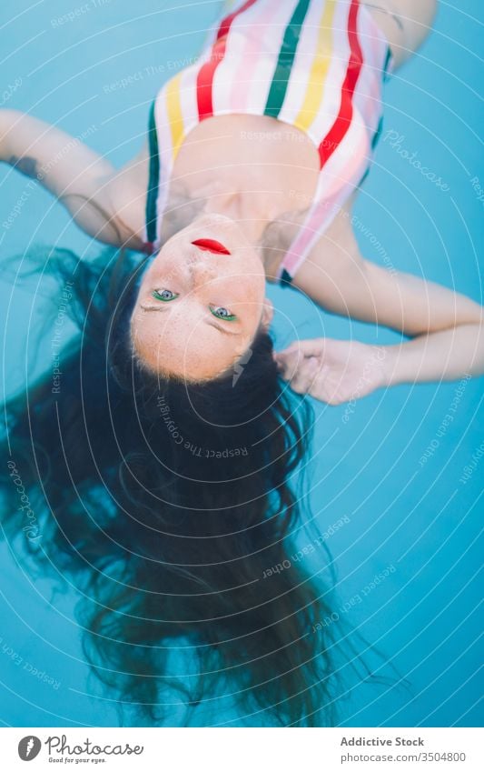 Teen Girl Having Fun In The Swimming Pool summer water portrait girl happy person swimming pool vacation young leisure teenager fun female beautiful lifestyle