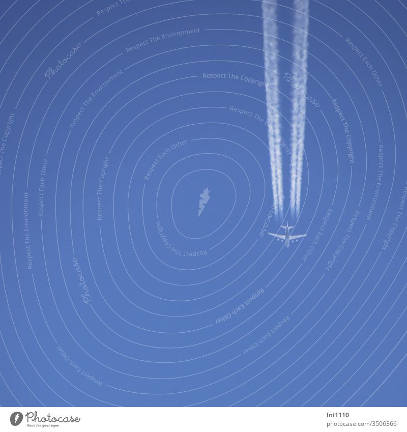 Airplane in the sky-blue sky Sky Sky blue Vapor trail perpendicular no clouds White Blue silver travel Itinerary air traffic Direction Beautiful weather Flying