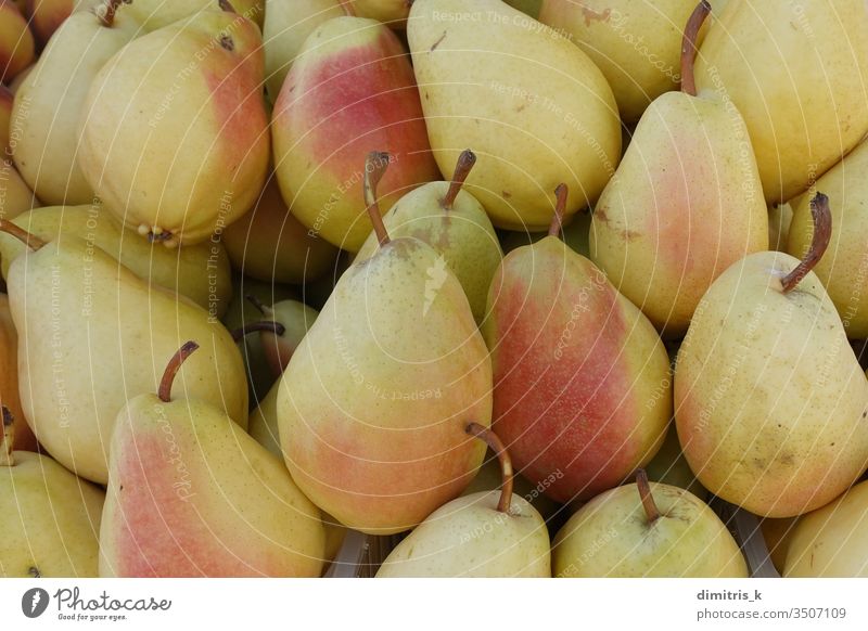 yellow pears fresh fruit background ripe red produce food edible pile many healthy snack agricultural closeup natural raw agriculture antioxidant fruits