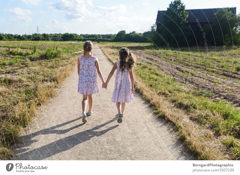 Two sisters play games - a Royalty Free Stock Photo from Photocase