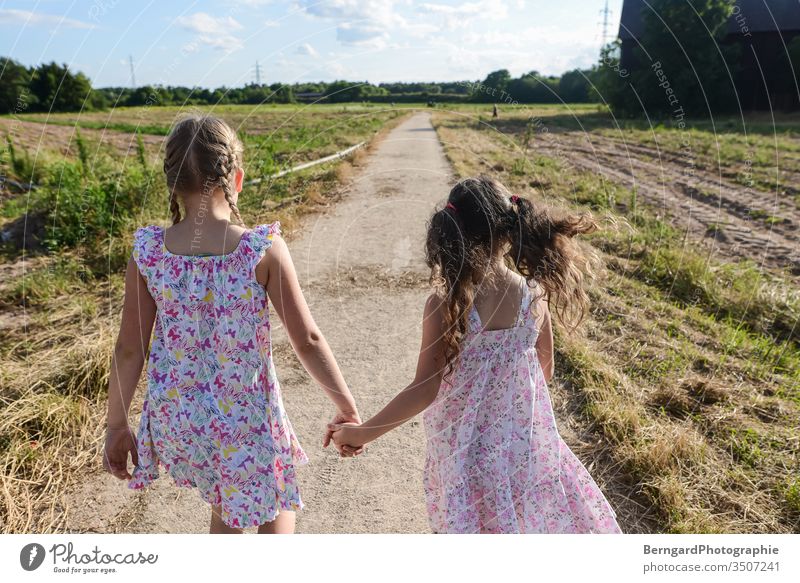 Two sisters play games - a Royalty Free Stock Photo from Photocase