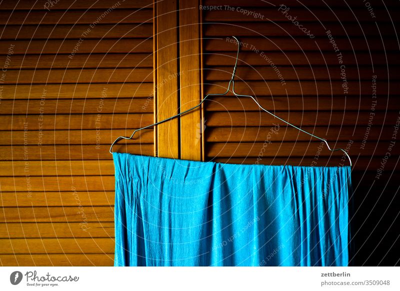Blue cloth on a hanger hangers Rag Towel slats lamella door Menchenleer Household Room Cupboard cupboard door Dry dwell Flat (apartment) Laundry room wood