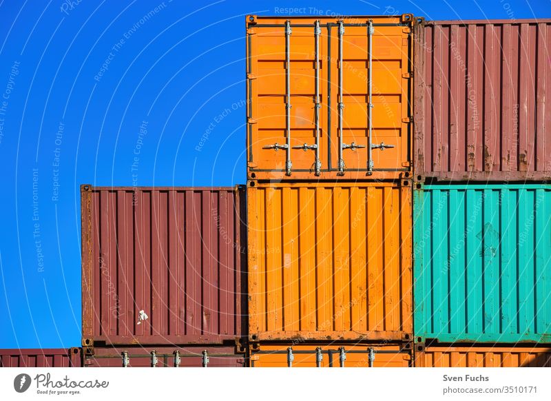 Several ship containers against a blue background Container Shipping container cargo Transport commodities Cargo shank Industry Harbour export Dock Navigation
