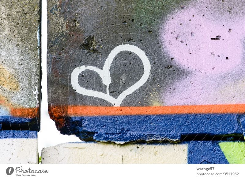 Graffito of a heart sprayed on a dreary concrete wall variegated Heart Wall (barrier) Concrete wall Wall (building) Colour photo Exterior shot Day Deserted