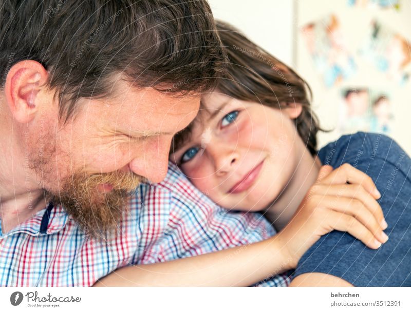 health | love proximity Cuddling portrait Contrast Light Day Detail Close-up Interior shot Colour photo Son Love Warm-heartedness Together Safety (feeling of)