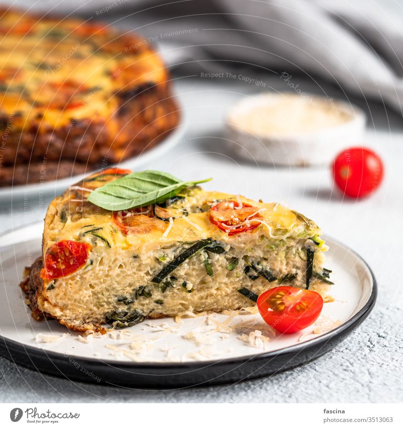 Piece of zucchini pie, copy space right recipe piece harvest homemade lot basil herb concept idea cement baking healthy cheese tomatoes savory delicious