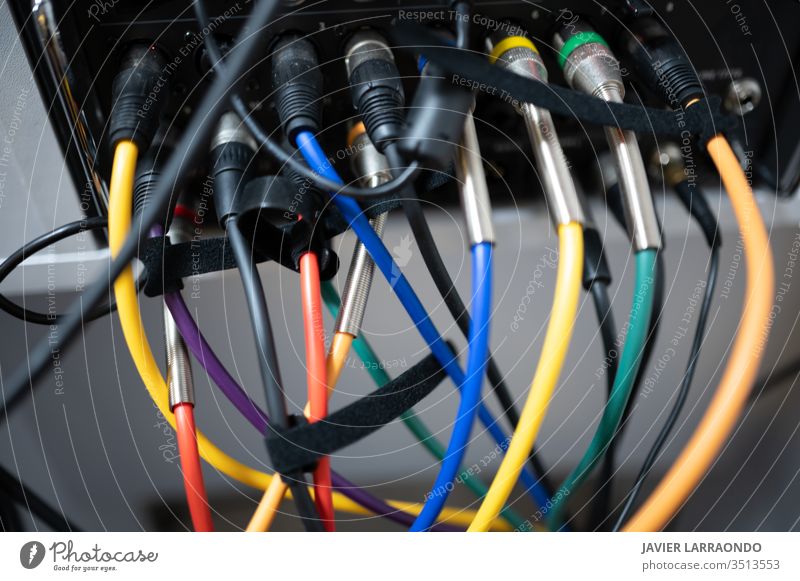 Various colored sound cables connected equipment colorful connectors artist audio back band electricity digital composer entertainment computer hobby instrument