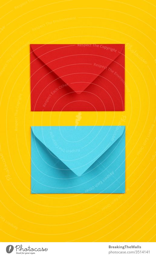 Download Two Closed Blue And Red Paper Envelopes On Yellow A Royalty Free Stock Photo From Photocase Yellowimages Mockups