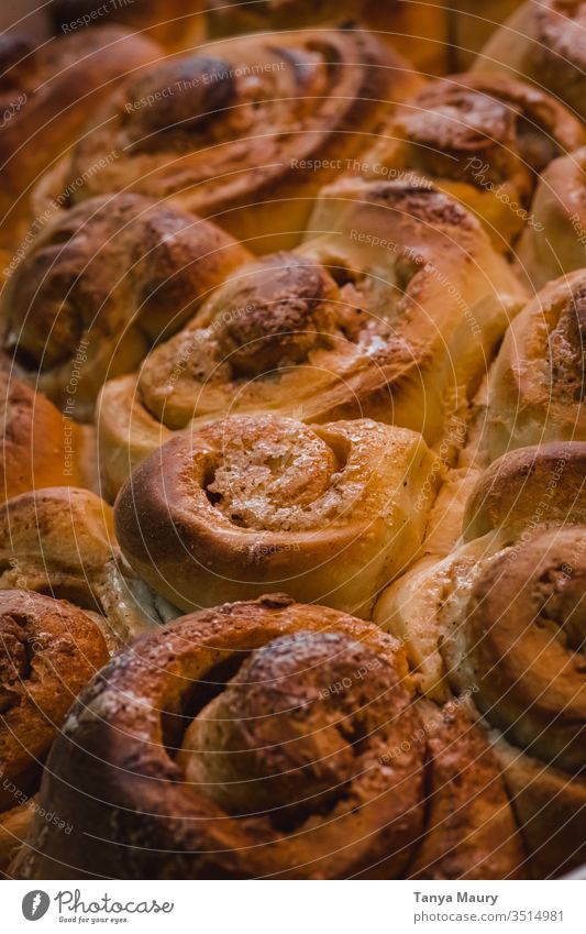 Cinnamon rolls stacked in a dish cinnamon rolls cinnamon cake cinnamon bun eating piece of cake bread Food photograph natural light indoor Cake Delicious