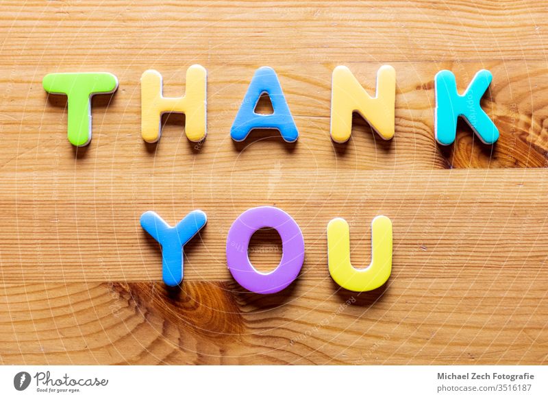 Thank You words written with colorful letters on wooden background Hand Handwriting abstract appreciate appreciation business card concept conceptual customer