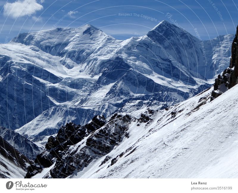 Trekking the Annapurna Circuit in winter, enjoying the beautiful mountain view and the amazing sunshine in the Himalaya. snow alps landscape mountains sky peak