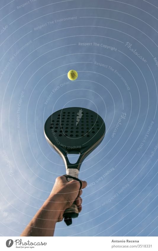 Paddle tennis shot in the air, hand, racket and ball paddle tennis padel isolated close up close-up pádel sport objects sports recreation human hand serve grab