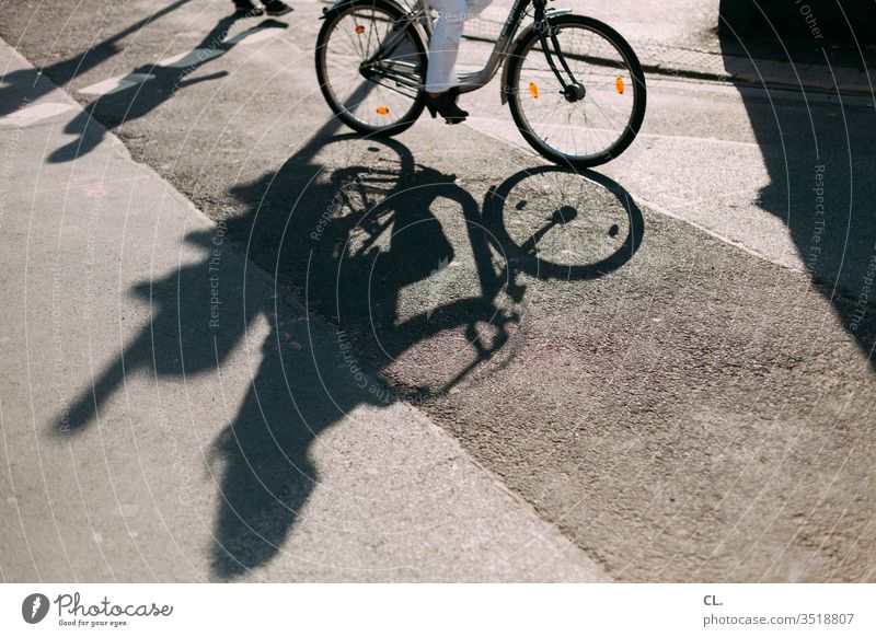 cycling in the city Bicycle Shadow Street Traffic infrastructure Means of transport Transport Cycling Road traffic Lanes & trails Mobility Road safety Town