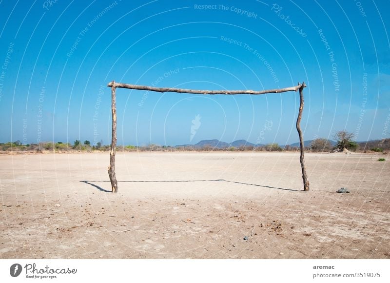 Homemade football goal on a clay court in Africa soccer Soccer Goal Football pitch Sports Sand Zimbabwe game Deserted Ball sports Sporting Complex