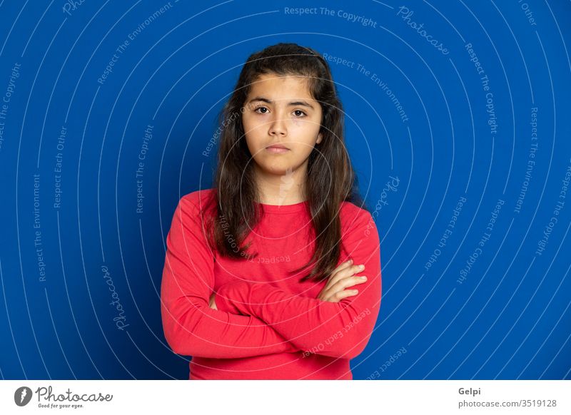 Preteen girl with red t-shirt preteen blue scared surprised horrified emotion gesture worried excited problem portrait expression female people person pretty