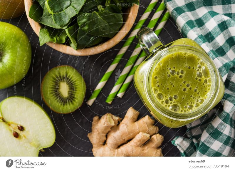 Healthy green smoothie in jar on black stone top view apple color composition cooked delicious detox diet dish drink food fresh fruit ginger glass good healthy