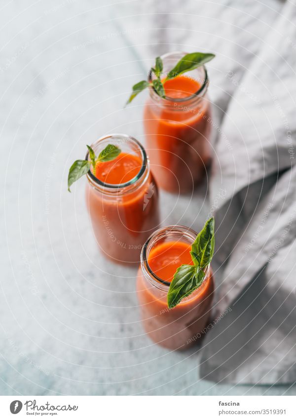 Gaspacho soup in glass bottles, vertical gaspacho tomato table gazpacho capsicum cold food red summer vegetable spanish vegan basil meal vegetarian background