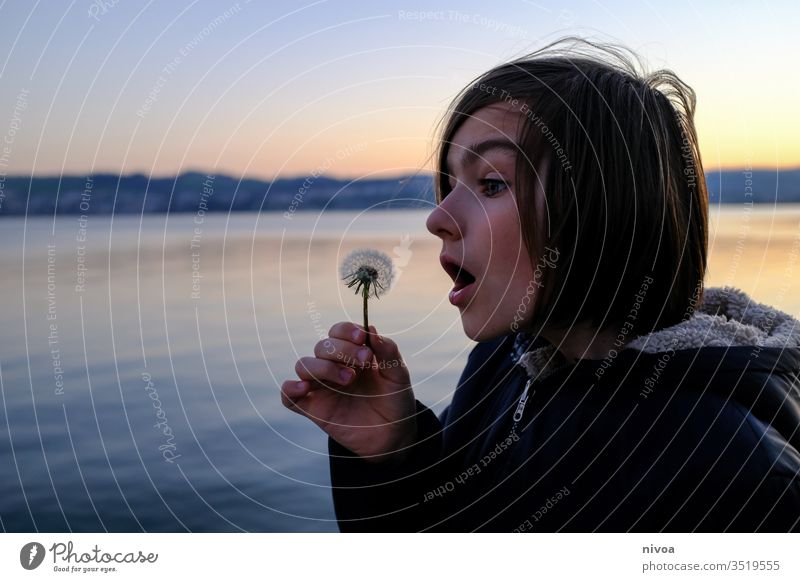 Boy and dandelion Boy (child) Close-up flowers Plant Nature lowen tooth Macro (Extreme close-up) Sámen Exterior shot Detail spring Colour photo Deserted