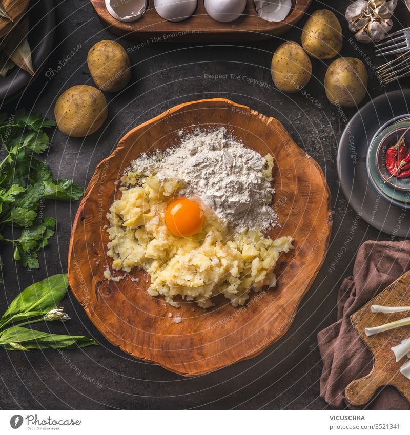 Homemade Potatoes Dough In Wooden Bowl With Flour And Eggs On Dark Kitchen Table Background Top View Gnocchi Preparation Tasty Home Cooking Vintage Cuisine Tasty Home Cooking A Royalty Free Stock