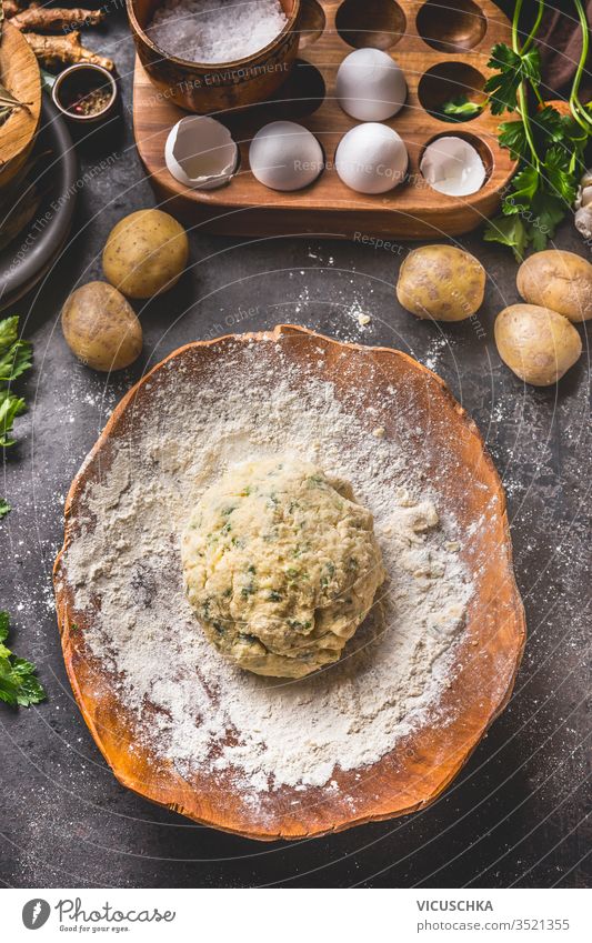 Homemade Potatoes Dough In Wooden Bowl With Flour And Eggs On Dark Kitchen Table Background Top View Gnocchi Preparation Tasty Home Cooking Vintage Cuisine Tasty Home Cooking A Royalty Free Stock