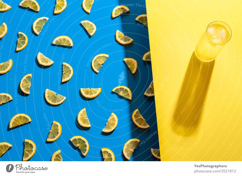 Glass of lemonade and lemon slices pattern. Summer cold drink aligned beverage bicolor blue citrus fruits cocktail colorful concentrate delicious detox duotone