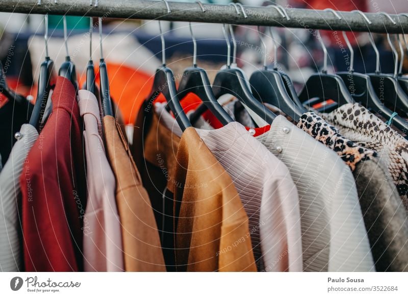 Colorful Clothes Hanging For Sale - a Royalty Free Stock Photo