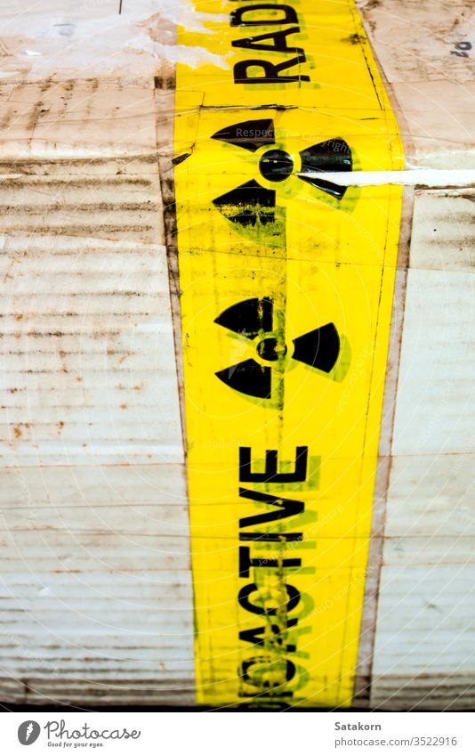 Radioactive material warning sign at the package radioactive symbol box paper industry danger radiation safety risk attention nuclear contamination label