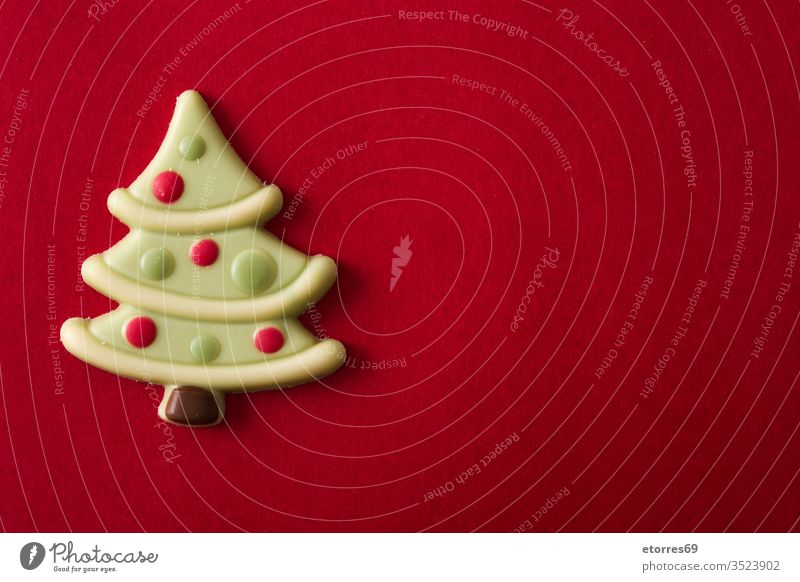 Christmas tree chocolate bonbon on red background copy space celebration christmas christmas tree decorative dessert festive food homemade pastry seasonal shape