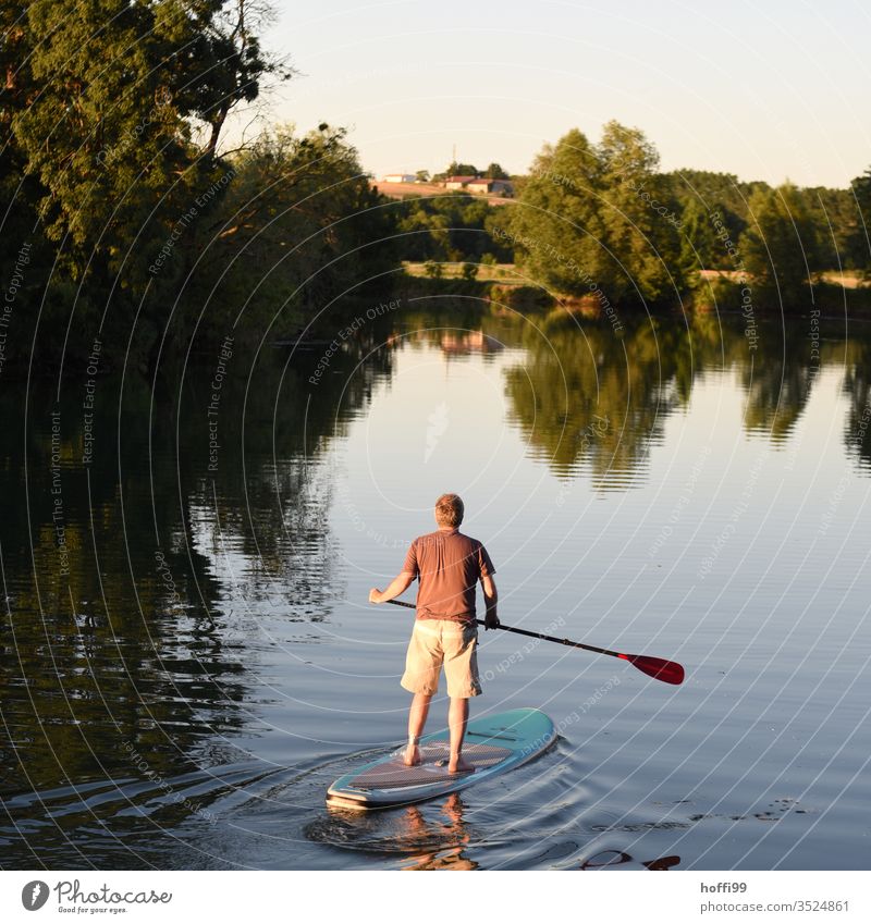 StandUp paddler with injured foot on calm water - vacation stand-up paddling SEA Human being Aquatics Summer Nature Sky Fitness Vacation & Travel Water