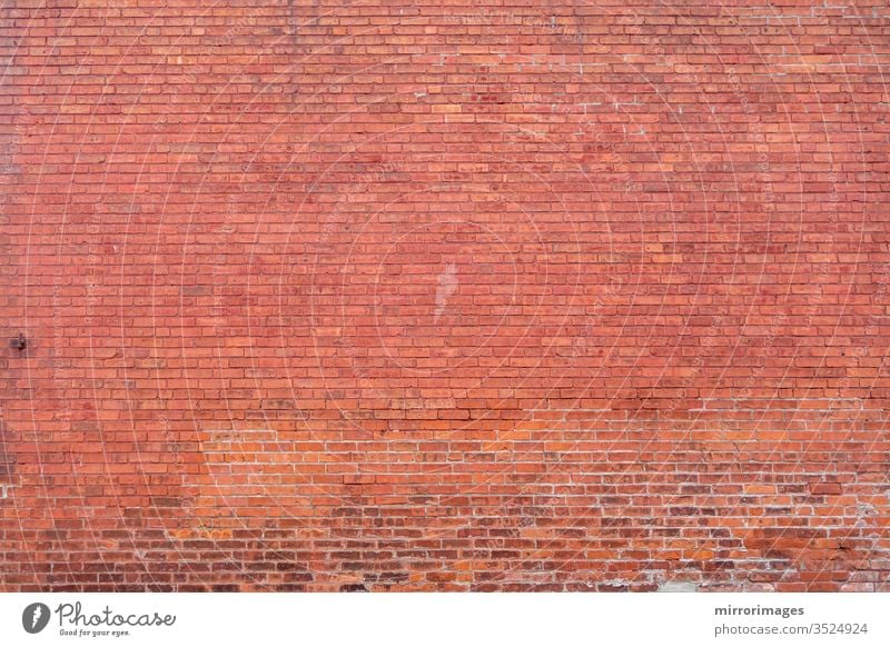 Distant building red brick wall surface body background full wall distant brick wall masonry textured space exterior construction design style orange brown