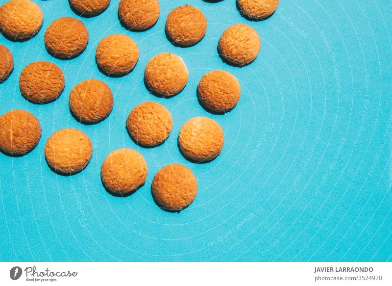 Tasty butter homemade cookies on a blue background.Homemade sweets concepts candy gold macro sweet food baked pastry copy space baking sugar tasty ingredient