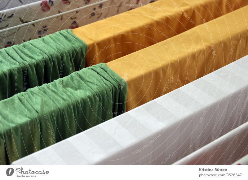 bed linen hangs to dry on the clothes horse Bedclothes Sheet Sheets Laundry Dry Cotheshorse Washing day neat Fresh variegated colored green Yellow White Cloth