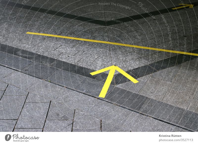 yellow arrows on the floor as distance and direction markers Arrow Markings Adhesive tape Ground gap detachment distance mark spacer distance marking Schedule