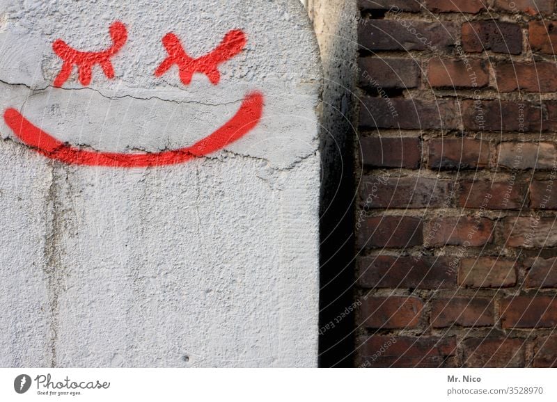 Close your eyes and smile Wall (barrier) Smiley Graffiti Red Brick wall Mouth peer Closed eyes Plastered White Wall (building) Abstract Sign Facade Dirty Seam