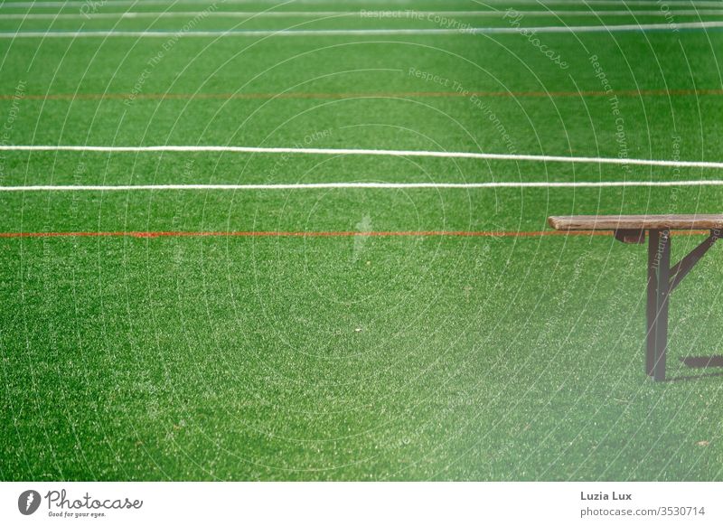 Empty bench on an empty sports field, with lots of sunshine Bench Ale bench Lawn Sporting grounds lines green Sun Sports soccer Playing Football pitch Line