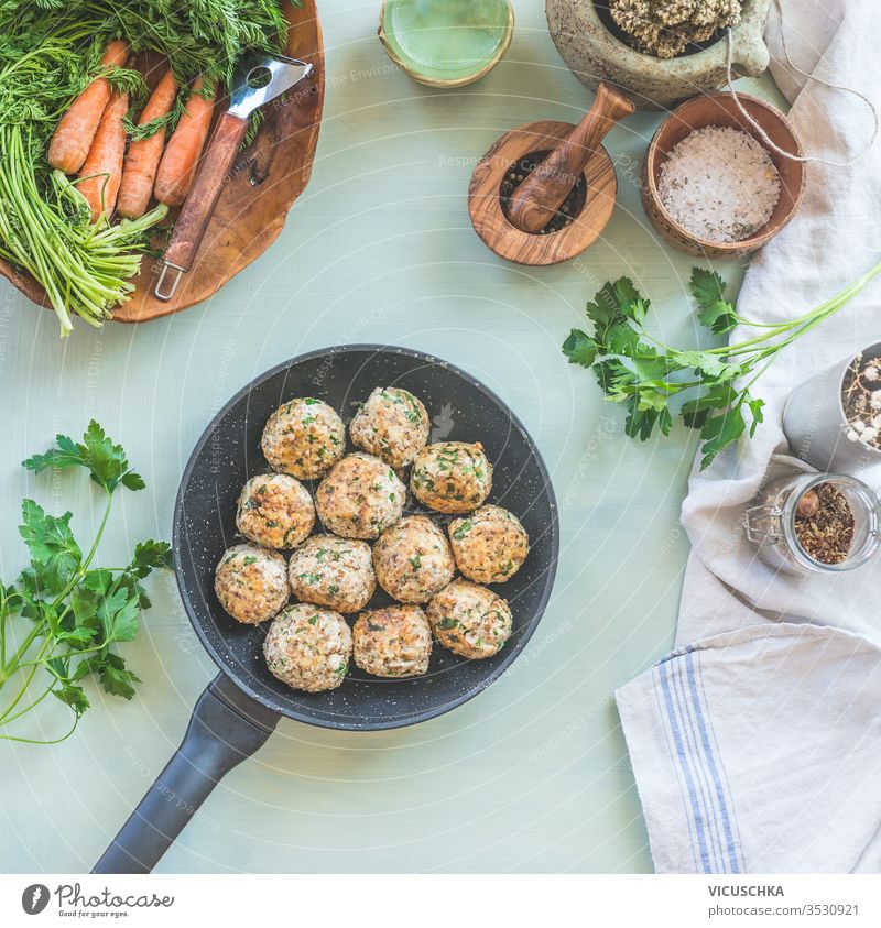 Delicious fried buckwheat balls in frying pan on kitchen table. View from above. Vegan food. Home cuisine delicious background seasonings herbs concept healthy