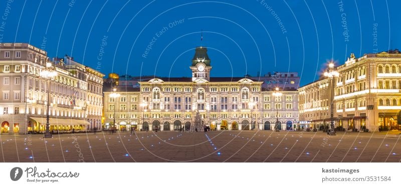 The City Hall, Palazzo del Municipio, is the dominating building on Trieste's main square Piazza dell Unita d Italia. Trieste, Italy, Europe. Illuminated city square shot at dusk.
