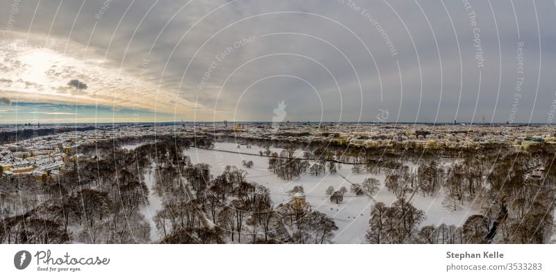 Aerial view of Munich at winter season in the snow, Germany above trees stream path nature munich landscape germany cold aerial bavaria drone surrounded high