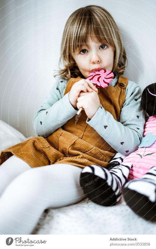 Girl with candy in bedroom stock photo. Image of healthy - 72851152