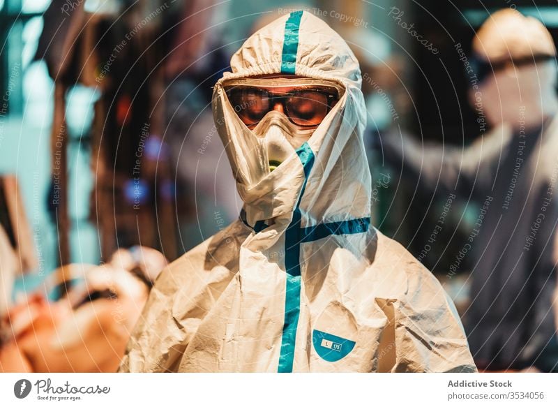 Professional doctor in protective uniform leaving operating room after operation surgeon sad mask tired devastated clinic upset serious specialist treat surgery