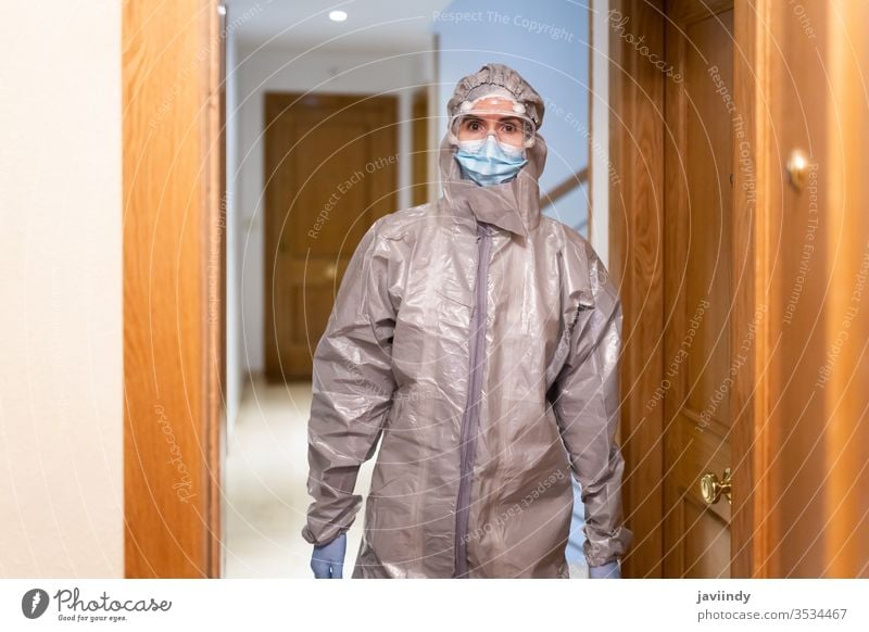 Doctor in PPE Personal Protective Equipment coming into the house doctor home ppe coronavirus medical concerned hospital equipment laboratory protective