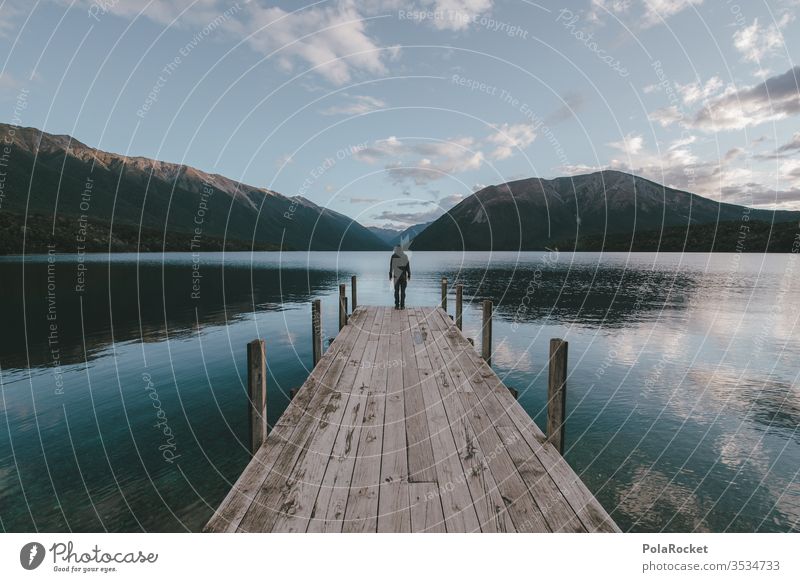 #As# man on pier Under sky above sea New Zealand New Zealand Landscape Footbridge Lake Lakeside Water Surface of water wooden walkway Adventure Hiking hikers