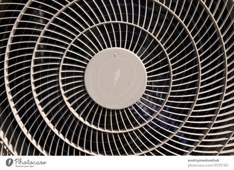 close up of air conditioner texture. Air condition cover texture. Gray protective plastic cover for air conditioner fan. Detail of industrial equipment. Close-up, abstract background, lattice pattern