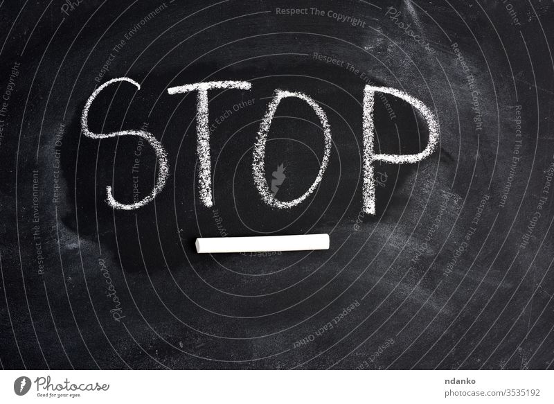 inscription english stop with white chalk on a black blackboard word wooden concept attention letter business communication text caution sign warning
