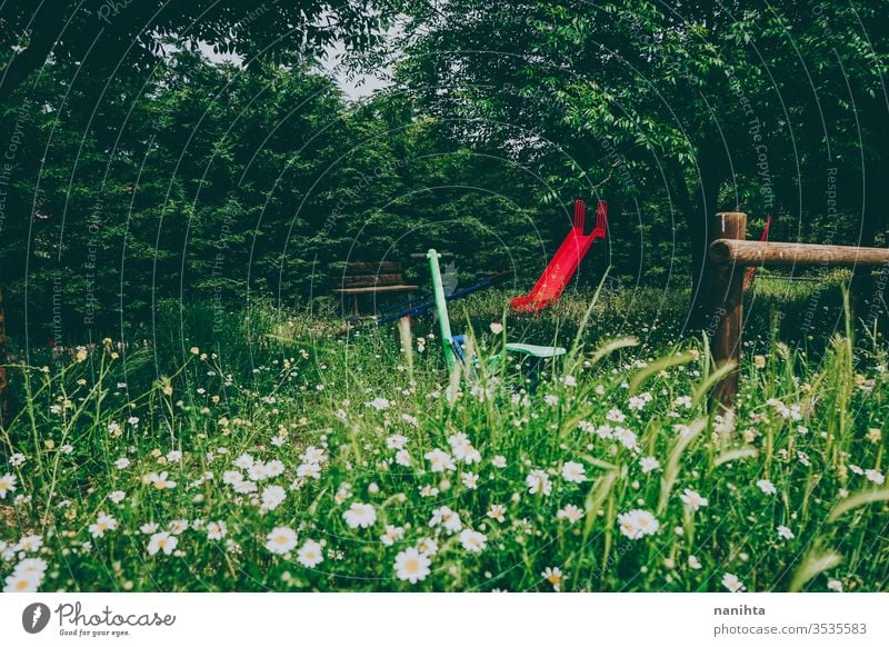 Abandoned park in spring full of flowers abandoned deserted beautiful bloom springtime wild rural rustic post post apocalyptic green beauty no people slide play