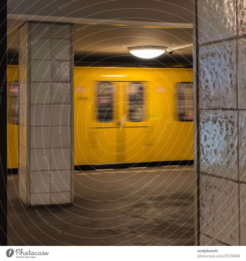 The old yellow berlin subway enters the subway station architecture arrival arrive arrives Berlin blur blur effect blurred building city design destination door