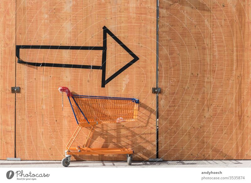 With the shopping cart always on the arrow after shoppingtour action Background benefits buy buying choice communication concept consumer consumerism copy space