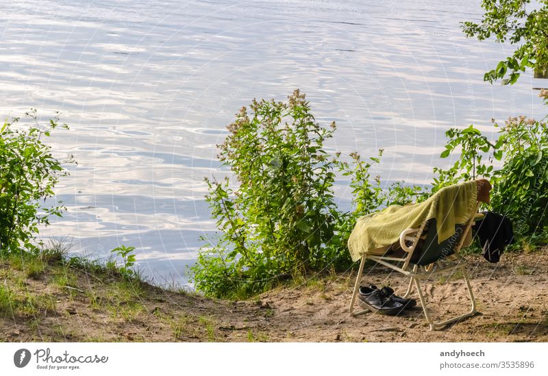 It is time to go swimming again bathing beach beauty in nature belongings Berlin black shoes chair environment fun garden grass green happiness holiday holidays