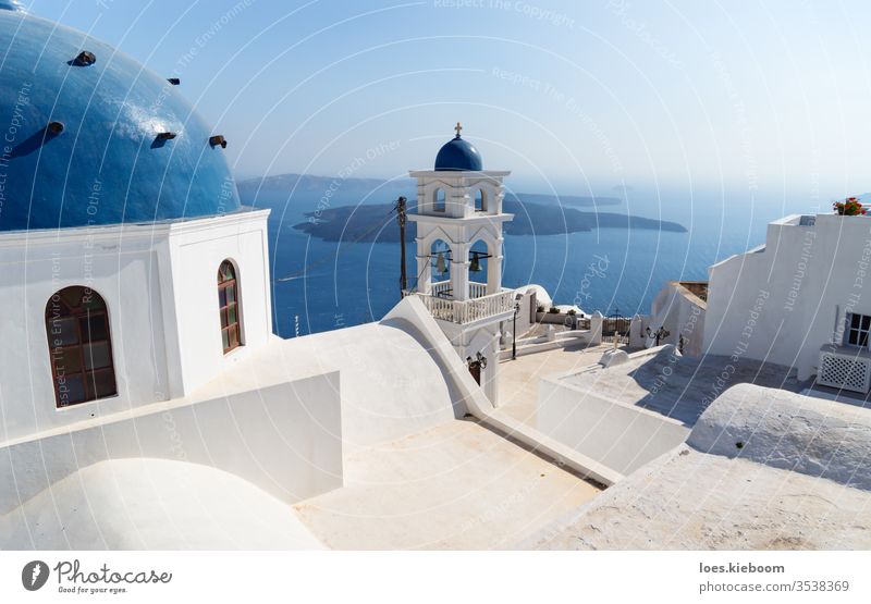 The dome and tower of Anastasi church with ocean and islands in the background, Imerovigli, Santorini, Greece blue greece architecture building caldera sea
